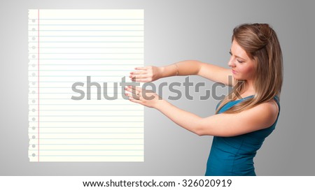 Pretty young lady holding white paper copy space with diagonal lines