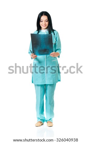 Female doctor examining an x-ray picture on white background