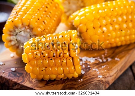 Grilled sweet corn closeup on cutting board