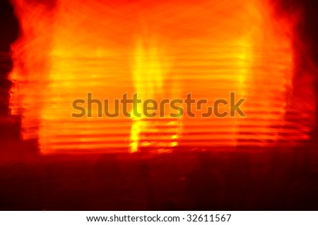 blurry images of bonfires on the beach