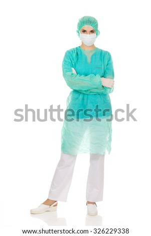 Female surgeon doctor in protective mask.