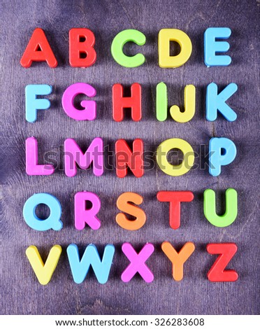 colorful plastic English alphabet on a bright background
