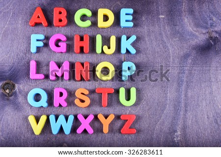 colorful plastic English alphabet on a bright background