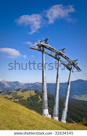Ski lift tower under high mountains, Gosau Austria