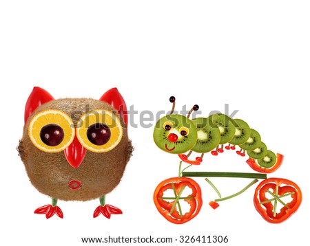 The little owl and a caterpillar on a bicycle made from vegetables and fruits