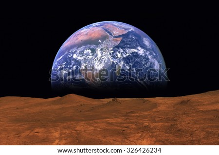 Imaginary view of earth rising from the horizon of plant Mars. Elements of this image are furnished by NASA Royalty-Free Stock Photo #326426234