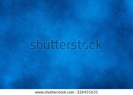 Blue texture background with bright center spotlight