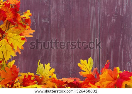Autumn Leaves Background with grunge wood and center for your message