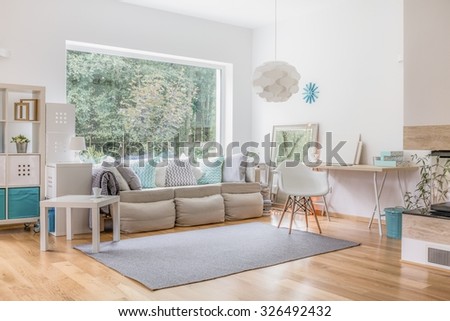 Cozy bright living room and big window Royalty-Free Stock Photo #326492432