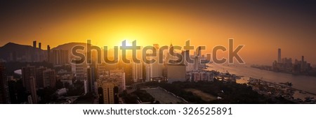 Panoramic view of Hong Kong skyline at sunset