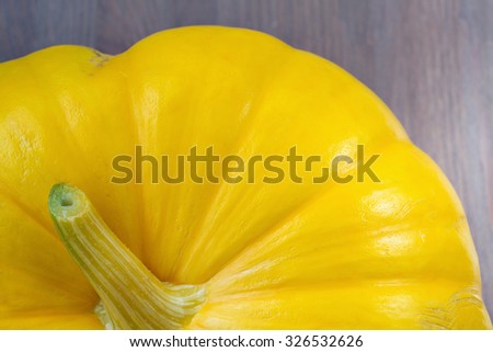 Raw pumpkin on wooden background