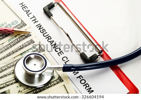 Health care costs. Stethoscope and calculator symbol for health care costs or medical insurance 