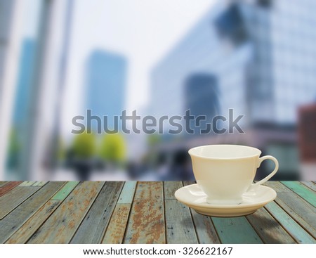 Cup of Coffee on the balcony with modern city view