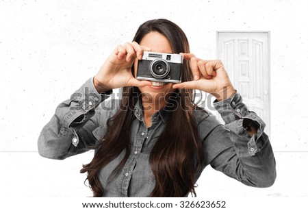 happy young woman with camera