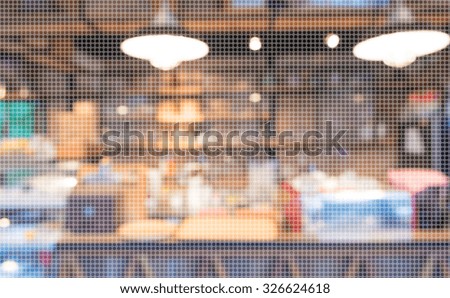 Empty wood table and Coffee shop blur background with bokeh image.(dot Pattern Pixelation effect image)