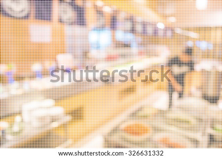 blur image of Abstract blurry sushi counter in vintage style decoration restaurant.(dot Pattern Pixelation effect image)