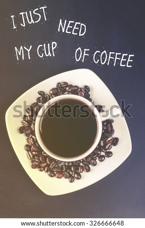 Coffee cup with coffee beans. Cross processed image with shallow depth of field