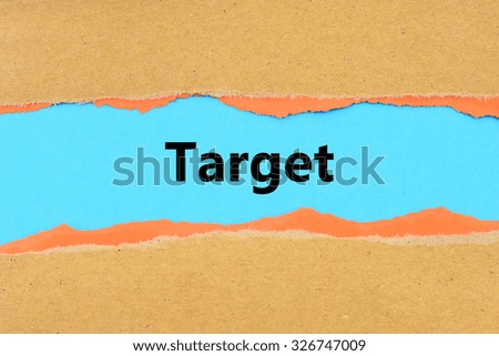 Torn brown and orange paper on blue surface with Target words.
