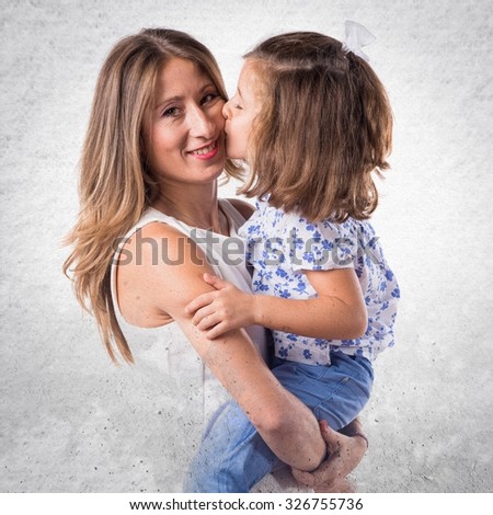 daughter kissing her mother