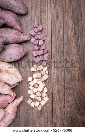 Sweet potatoes beautiful on a wooden table.