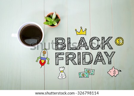 Black Friday message with a cup of coffee on a pastel green wooden table