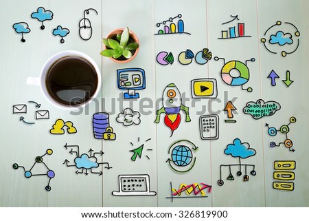 Creativity concept with a cup of coffee on a pastel green wooden table