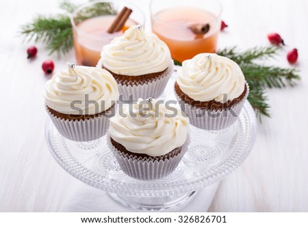 Homemade christmas cupcakes with creamcheese frosting on cake stand  for holiday treat