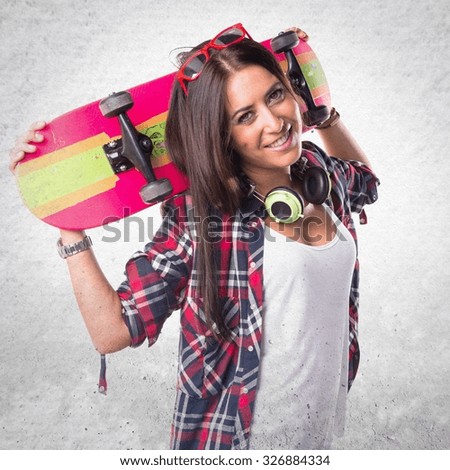 Beautiful woman holding a skate
