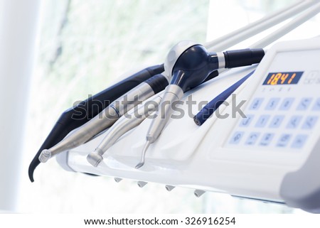 Equipment and dental instruments in dentist's office. Tools close-up. Dentistry Royalty-Free Stock Photo #326916254