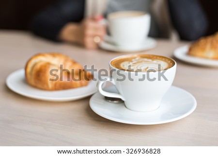 delicious coffee with croissant Royalty-Free Stock Photo #326936828