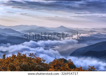 Misty mountains lanscape in morning.autumn in korea Royalty-Free Stock Photo #326954717