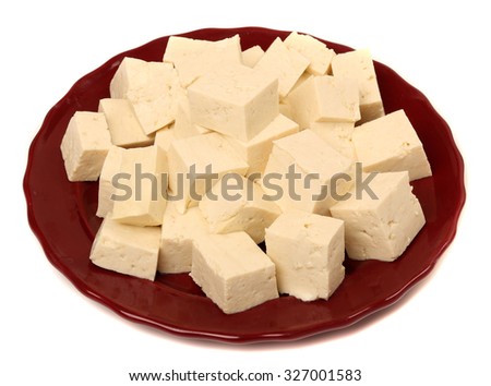 Tofu cubes on plate isolated on white background

