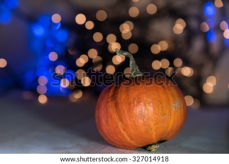 pumpkin on the defocused lights bokeh background. Halloween concept