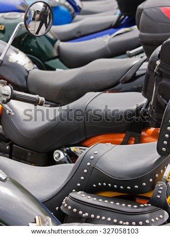 A line of motorcycles on display at a bike rally in UK Royalty-Free Stock Photo #327058103