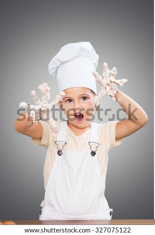 Child making cake.