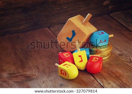image of jewish holiday Hanukkah and wooden dreidels (spinning top).
