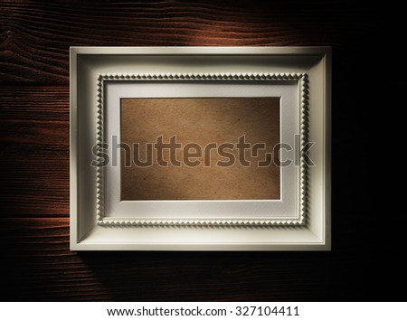 Empty wooden frame on wood background