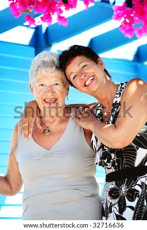 Our wonderful Greek holidays - beautiful senior mother and daughter smiling