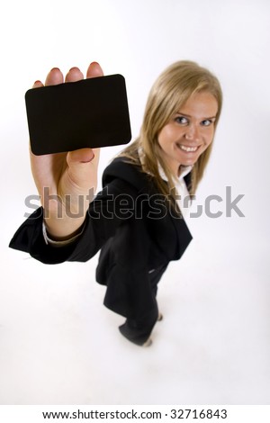 wide angle picture of an attractive businesswoman presenting a blank card