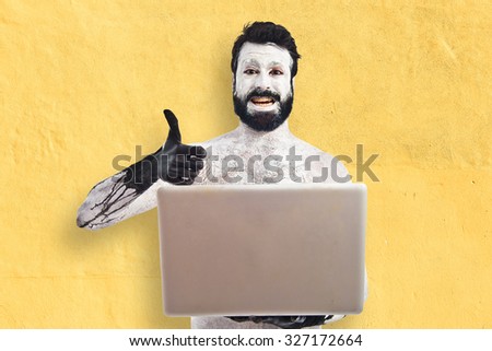 Prehistoric man with laptop