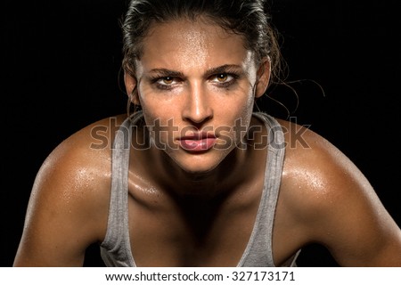 Serious confident stare champion athlete wrestler exercise trainer conviction focused powerful modern female Royalty-Free Stock Photo #327173171