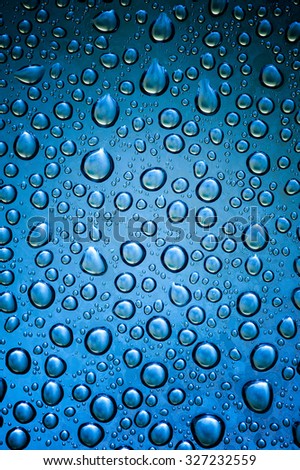 Drops water on the clear glass background