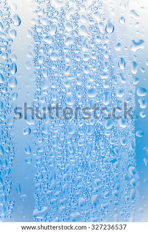 Drops water on the clear glass background