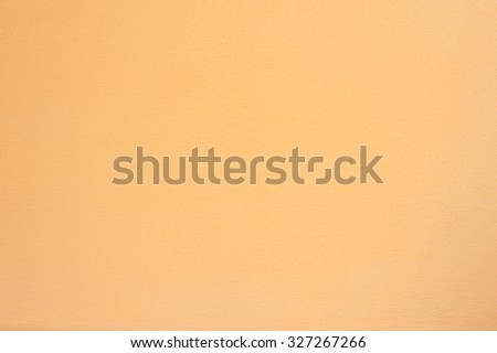 Orange peach rough concrete wall surface, seamless uneven abstract background