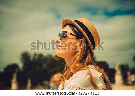 Beautiful joyful young woman enjoying her Paris travel. Fashion young blonde woman portrait