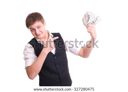 Handsome young man holding money isolated over white background