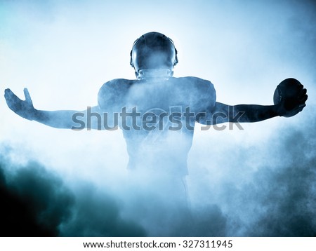 one American football player portrait in silhouette shadow on white background