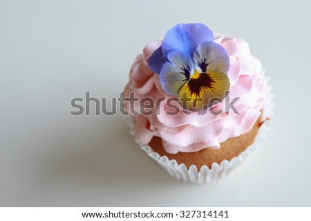 Pink frosting vanilla almond cupcakes with edible flowers, keto, ketogenic, low carb diet, sugar free, and  gluten free dessert