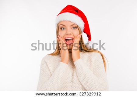 surprised cute girl with santa's hat