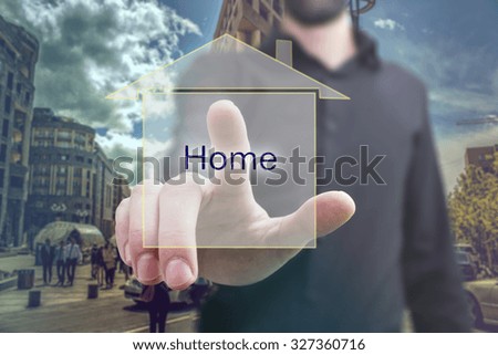 businessman pressing real estate button on virtual screens